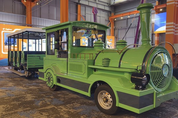 Guests boarding the trackless train at a park station