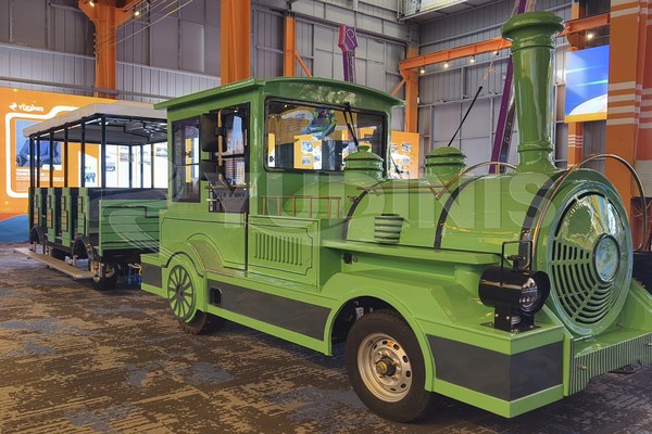 Guests boarding the trackless train at a station